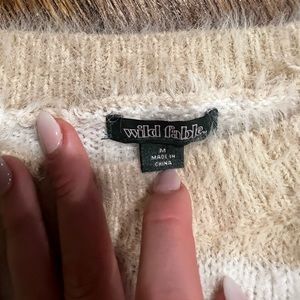 tan and white striped sweater